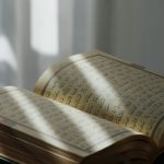 Crafting Captivating Headlines: Your awesome post title goes here An open Quran with Arabic text, bathed in soft sunlight, symbolizing peace and spirituality.